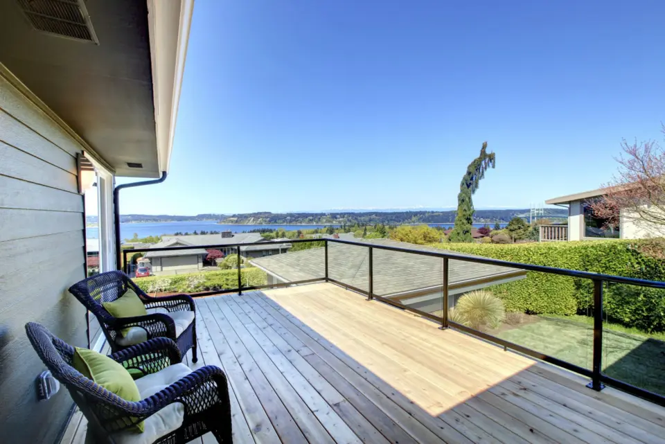 Commercial decking with glass railing featuring nature scenery