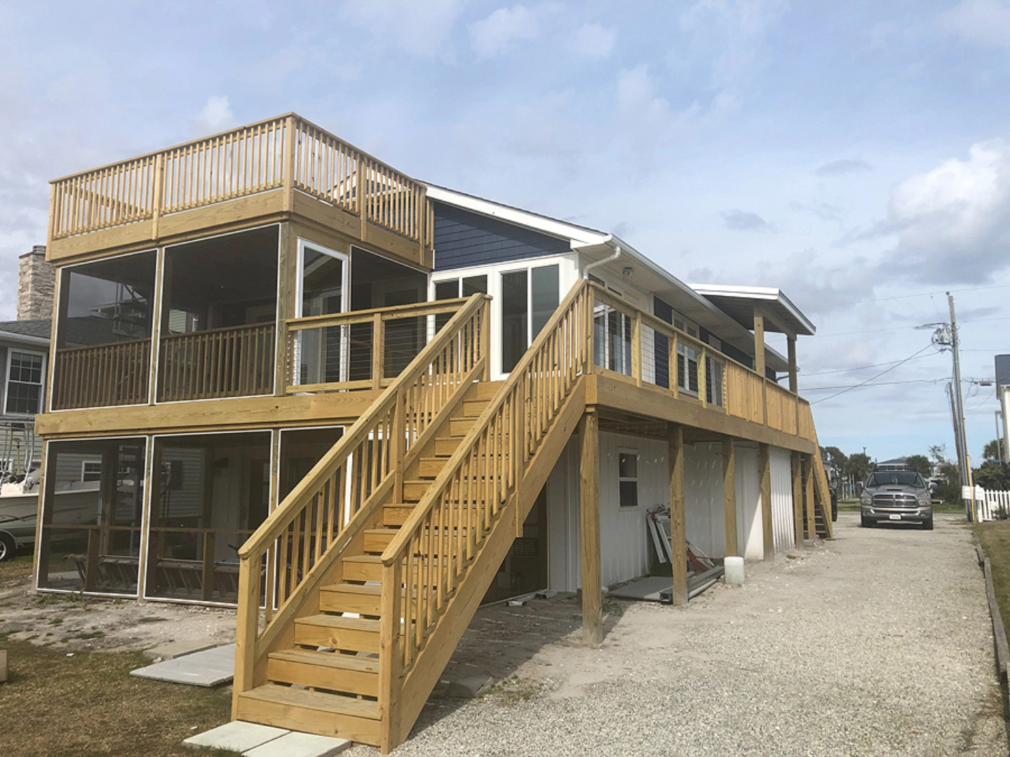 Elevated custom hardwood deck with a screened porch in wilmington nc