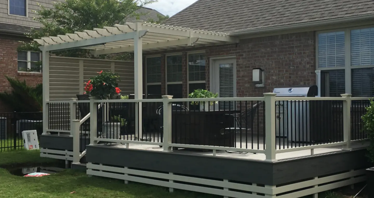 Elevated wood deck with railing and pergola