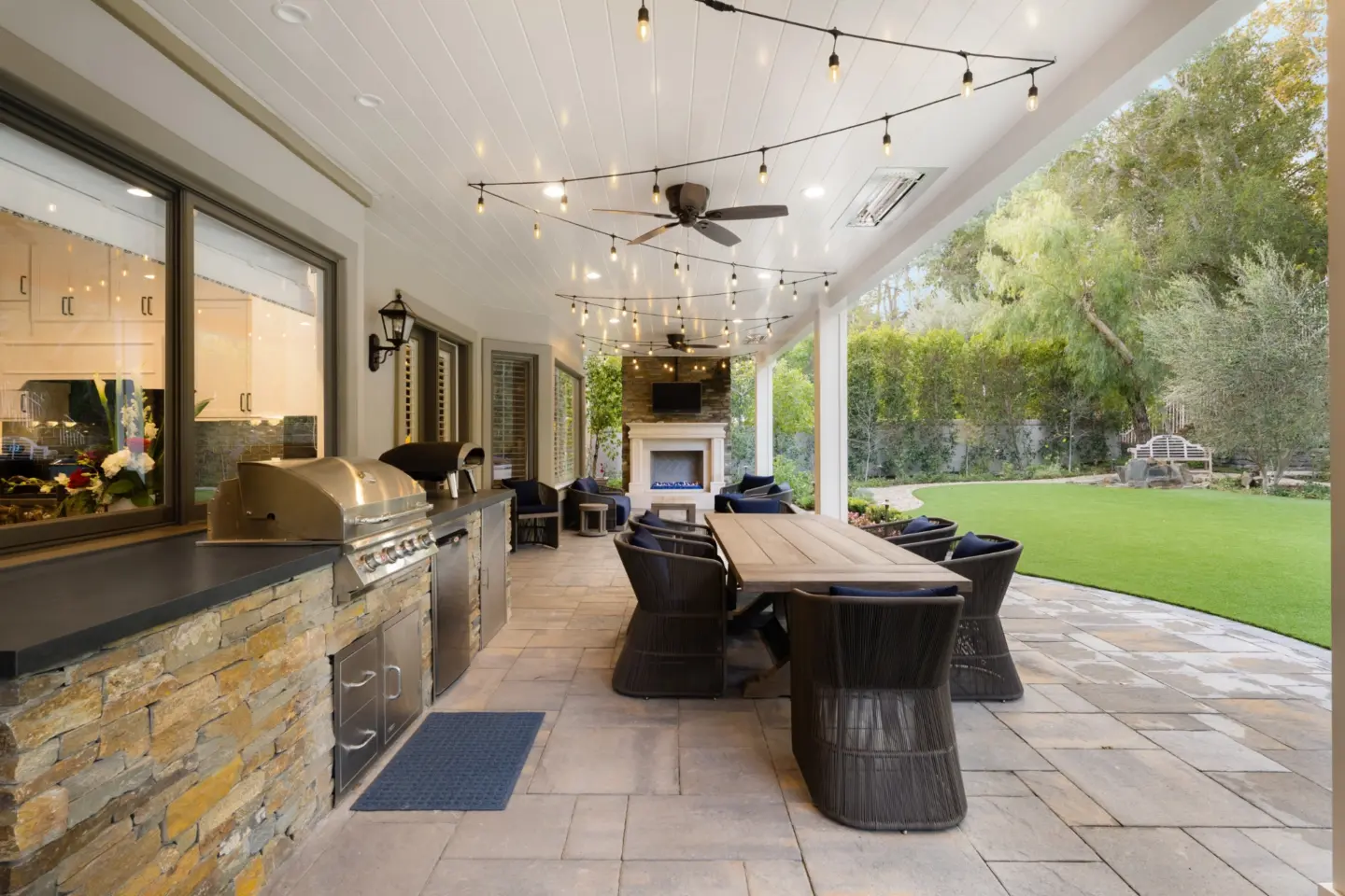Interior shot of an outdoor kitchen with fireplace in wilmington nc