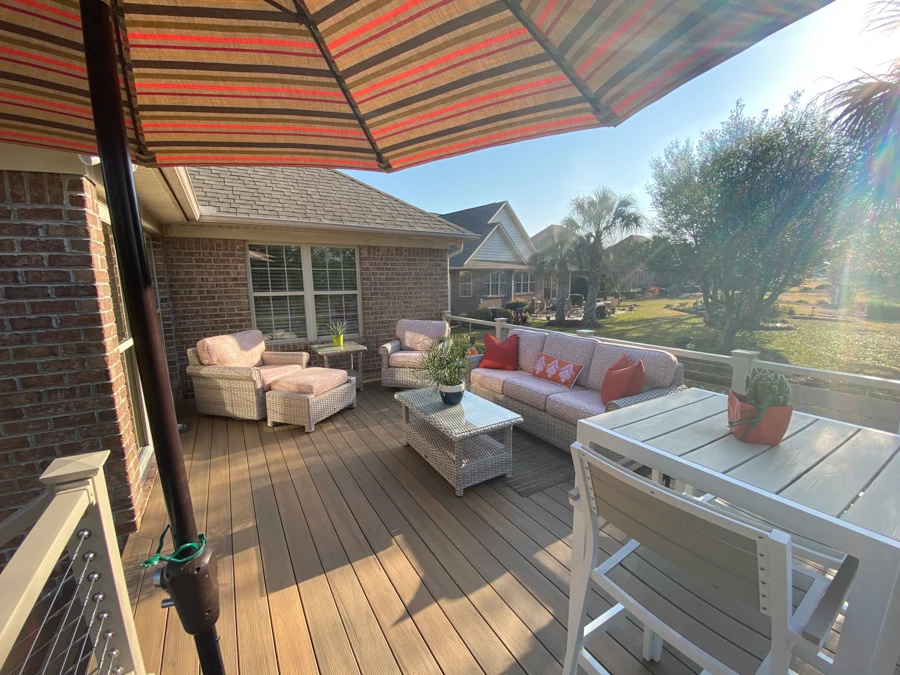 Modern composite deck installation with outdoor living furniture