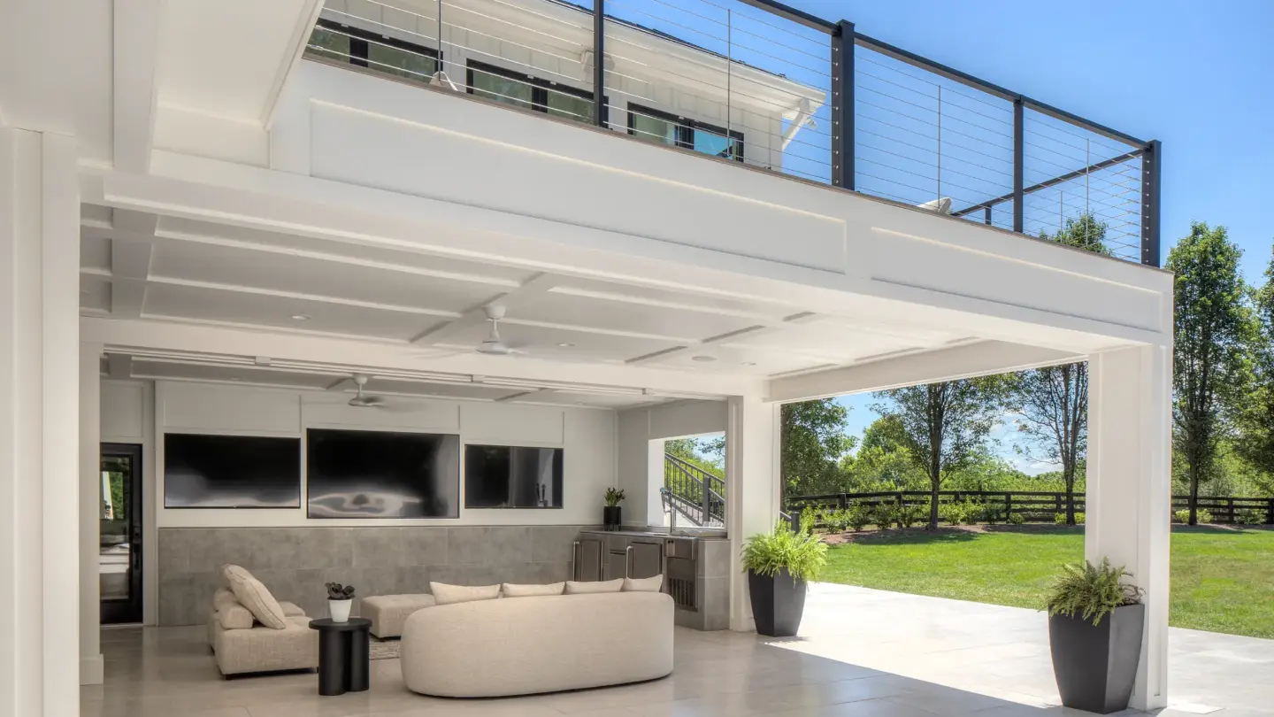 Outdoor living room under deck with wire railing on the wilmington