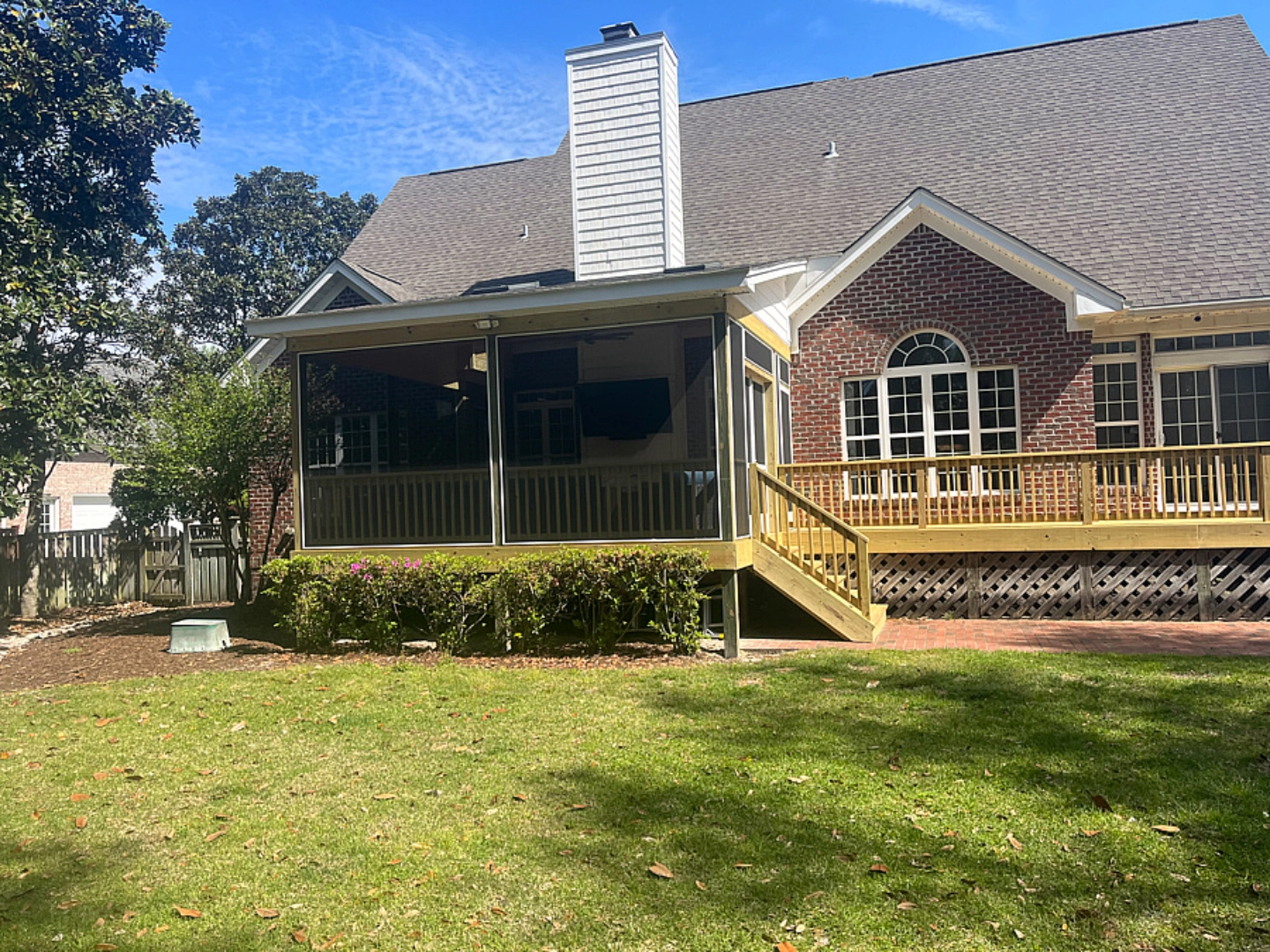 Outdoor screened in porch living space and deck with skirting in wilmington nc