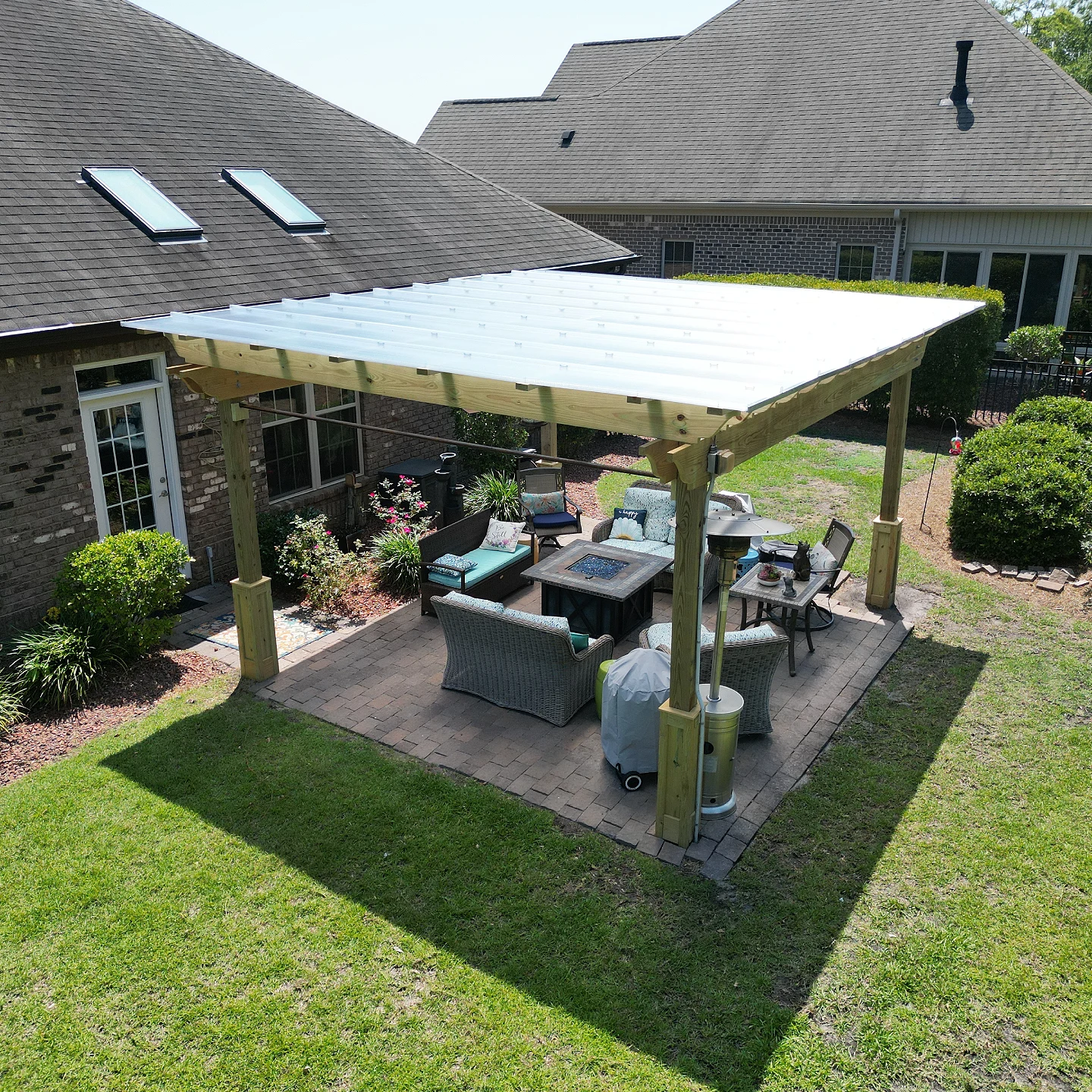 Patio with custom pergola and outdoor firepit on the wilmington