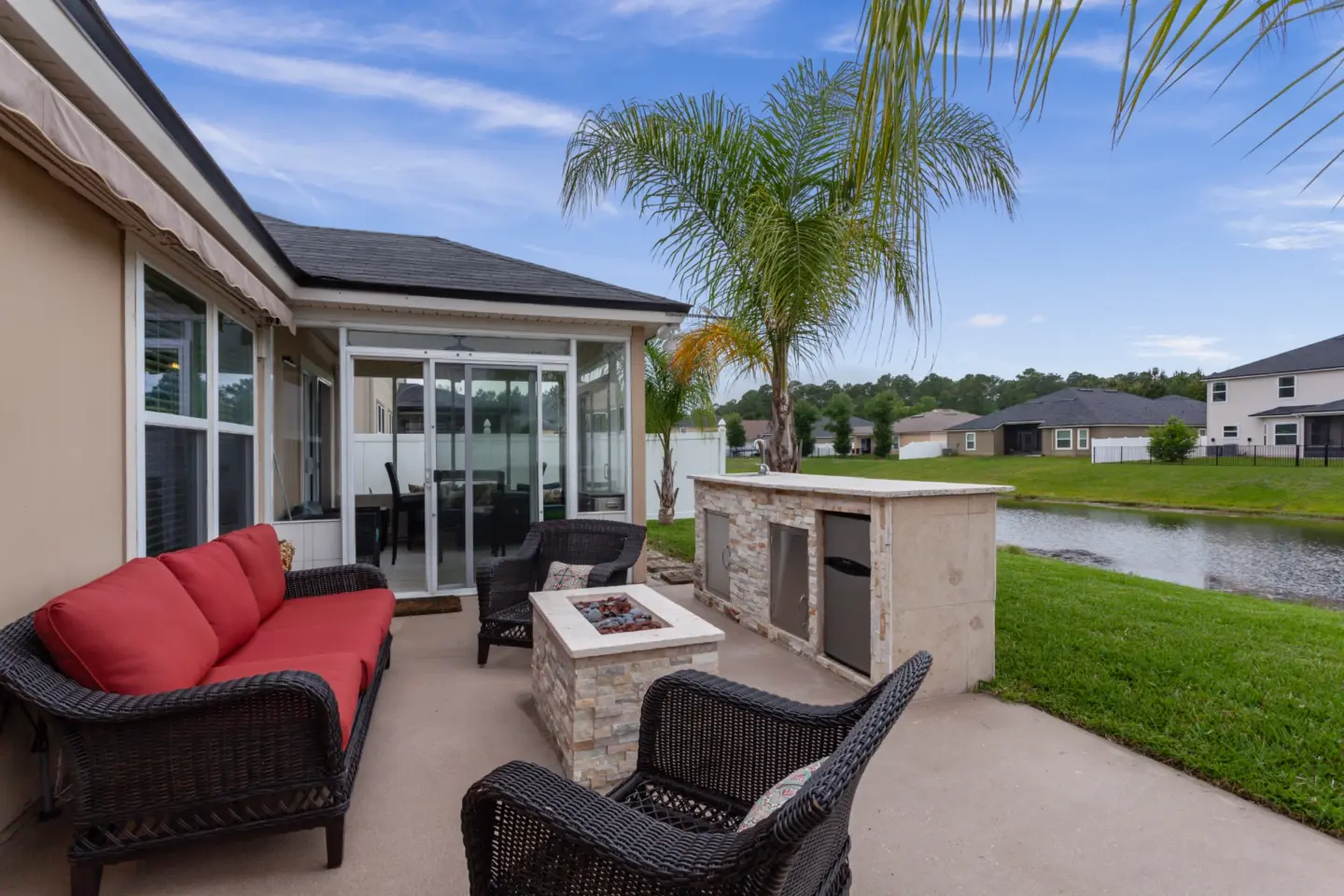 Patio with outdoor kitchen and firepit in wilmington nc