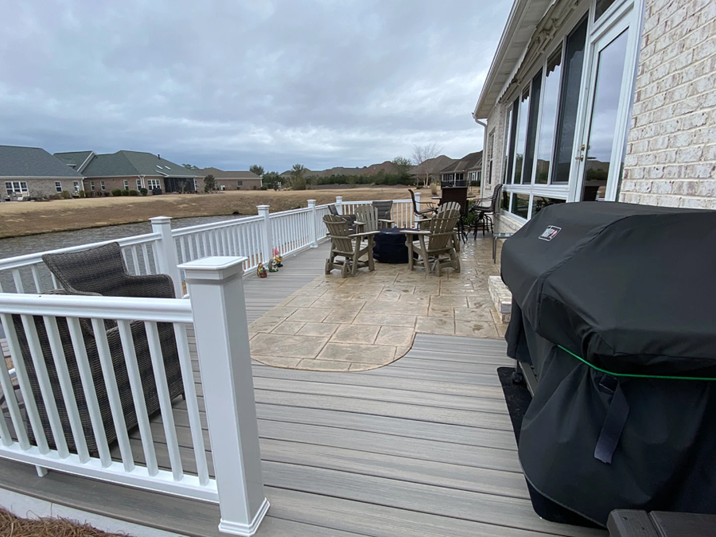 Pvc decking backyard installation with outdoor furniture and white deck railing on the wilmington