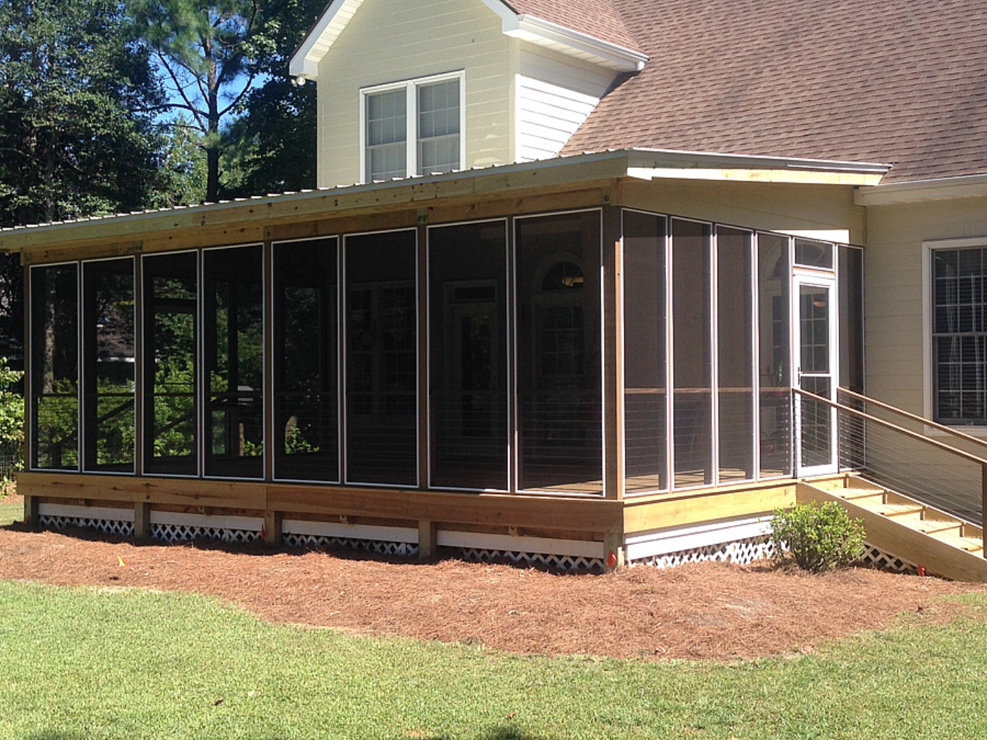 Screened in porch with clean lawn on the background in the wilmington nc